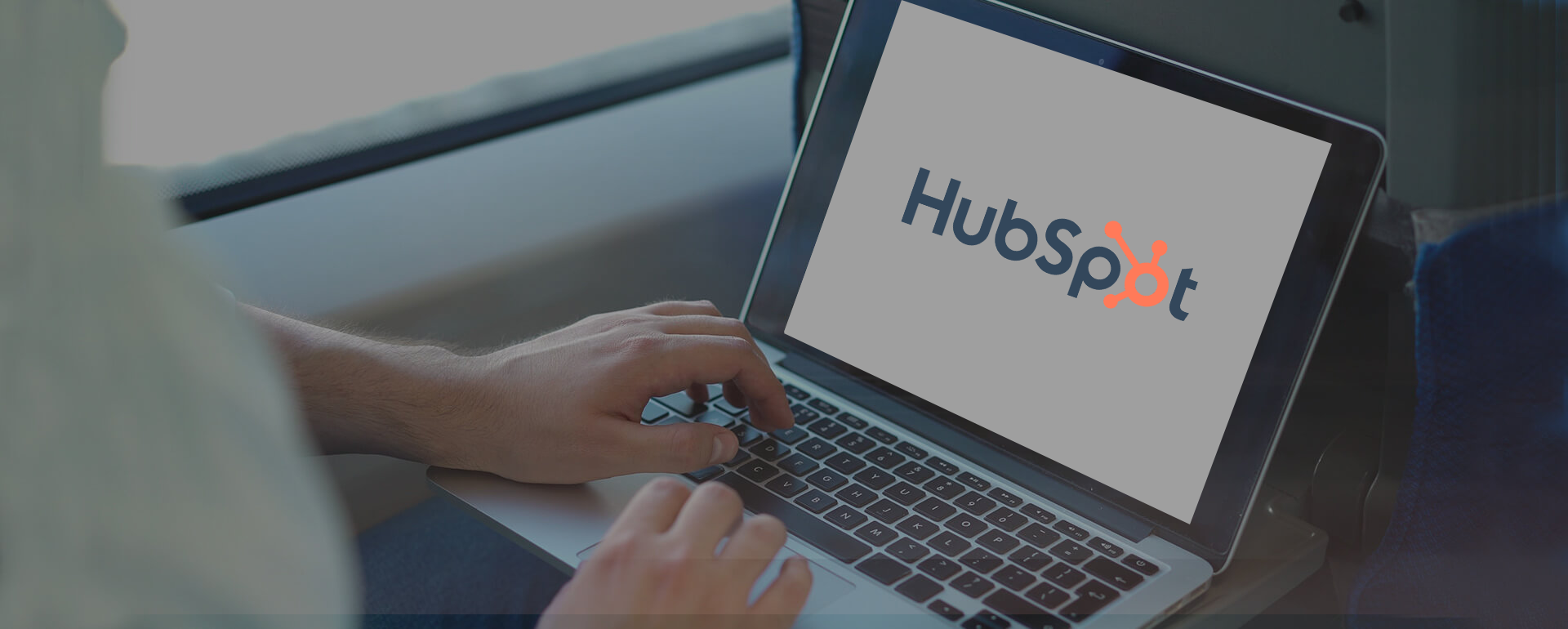 HubSpot logo displayed on a laptop screen